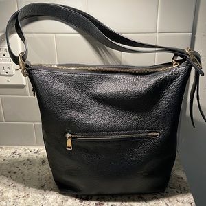 Coach purse- black leather with gold hardware.